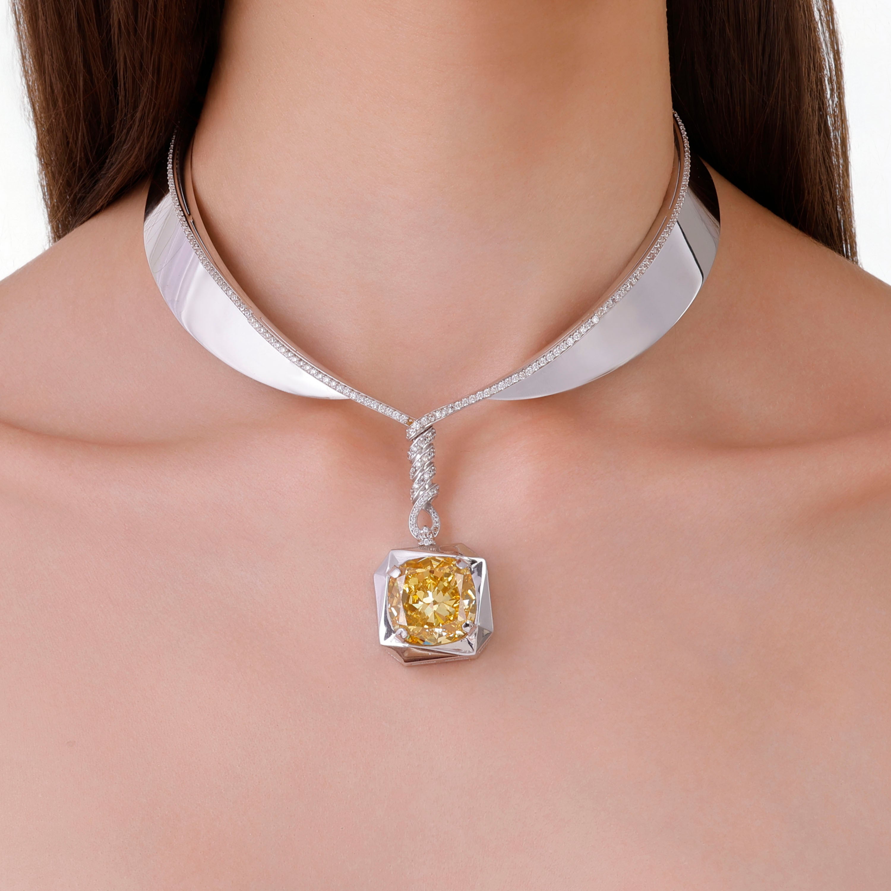 Choker necklace featuring a large yellow diamond set in a geometric frame